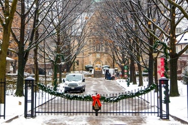 a photo of a holiday decoration adoring gates on the St. George campus