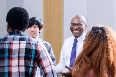 Wisdom Tettey laughs and speaks to students