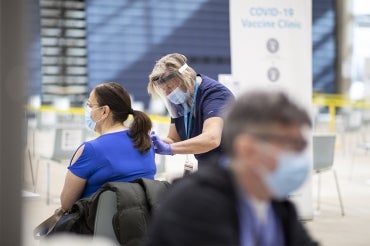 A person receives their covid-19 vaccination at the UTM vaccine clinic