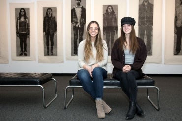 Student curators Nikita Lorenzo-Vicente and Amanda McNeil
