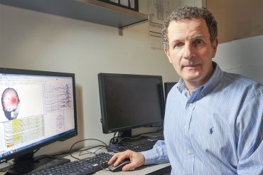 photo of Zindel Segal sitting in front of a computer