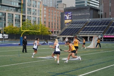 Women playing lacrosse at the Varsity Blues stadium