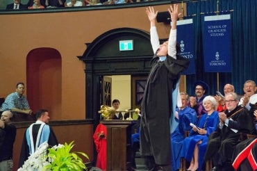photo of grad on stage