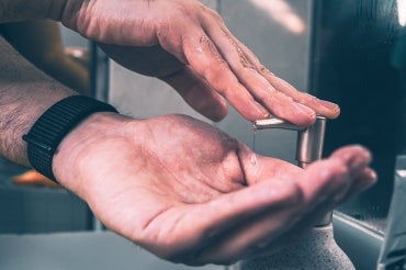 Close-up photo of hands being washed