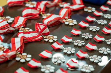 Order of Canada medals arrayed on a table