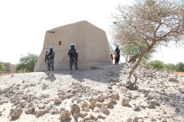 UN peacekeepers stand guard outside a restored mausoleum in Timbuktu