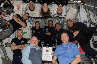 11 astronauts, including mark pathy, on the international space station