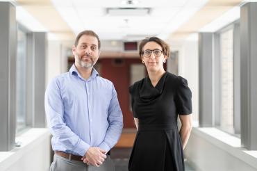 Robert Kozak and Samira Mubareka stand in a hallway