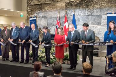 Cutting the ribbon - from left to right: Campaign Co-Chair Tom Rahilly, Chancellor Michael Wilson, the Hon. Hal Jackman, Dean Ed Iacobucci, Governing Council Chair Shirley Hoy, the Hon. Chrystia Freeland, Minister of International Trade with President Meric Gertler, alumnus and MP Arif Virani and Christina Liao, student gonfalonier.