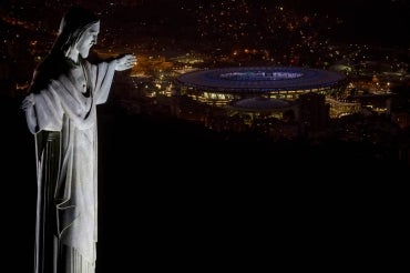 Statue of Christ the Redeemer overlooks Rio de Janeiro's Maracana Stadium