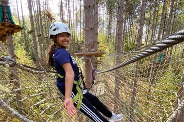 Divya Dey on a treerop rope course