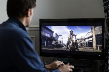 Photo of person playing a video game