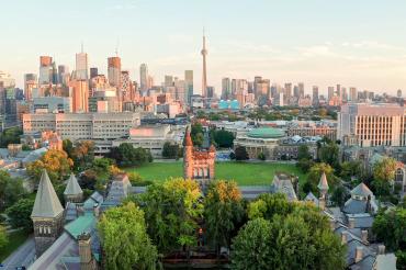 aerial photo showing a lush green university of toronto campus at dusk