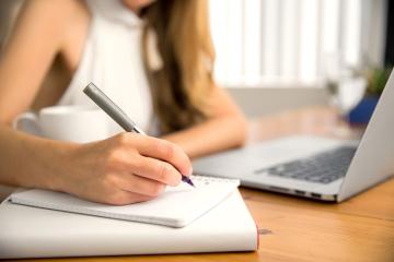 Photo of woman budgeting