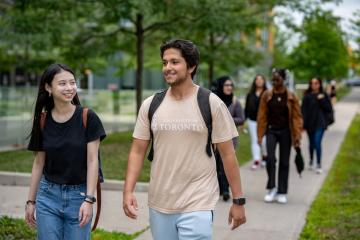 two students walking to UTSC