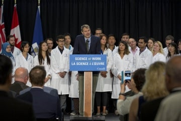 Peter Zandstra stands at the podium in front of a group of researchers at the CFREF funding announcement