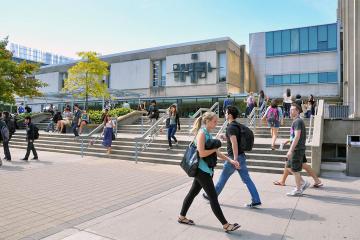 Students walking in front of Sid Smith building