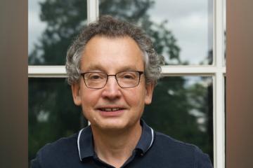 Professor Dyzenhaus in front of a window