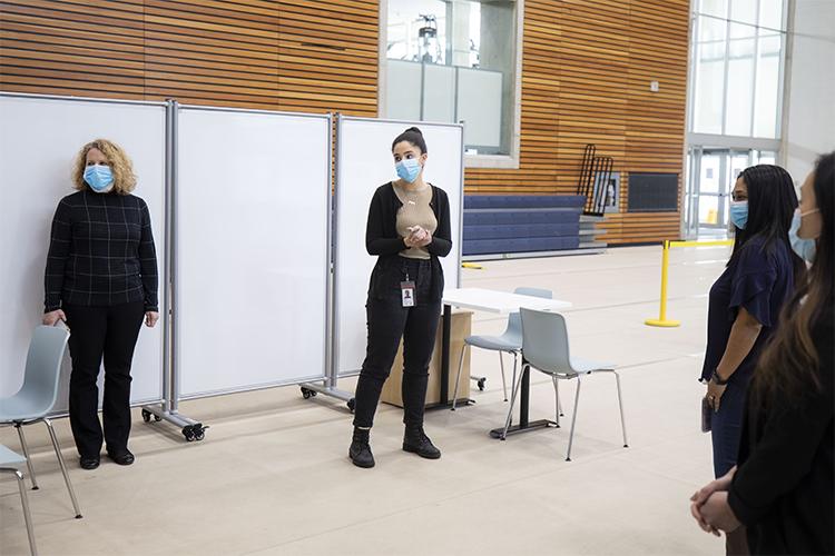 Reem El-Ajou’s duties include tracking and updating the progress of the vaccine clinic’s plans