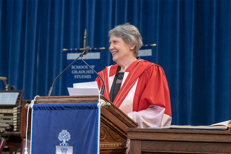 Helen Clark smiling at the podium during her honorary degree ceremony