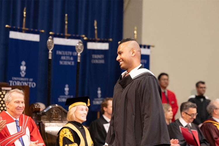 Jaivet crosses the stage during convocation