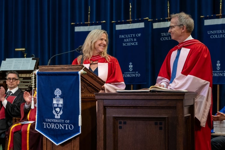 Joannah Lawson looks warmly at Brian Lawson as they stand on stage together