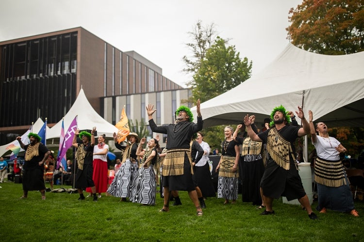 Maori visitors doing a haka for the assembled crowd