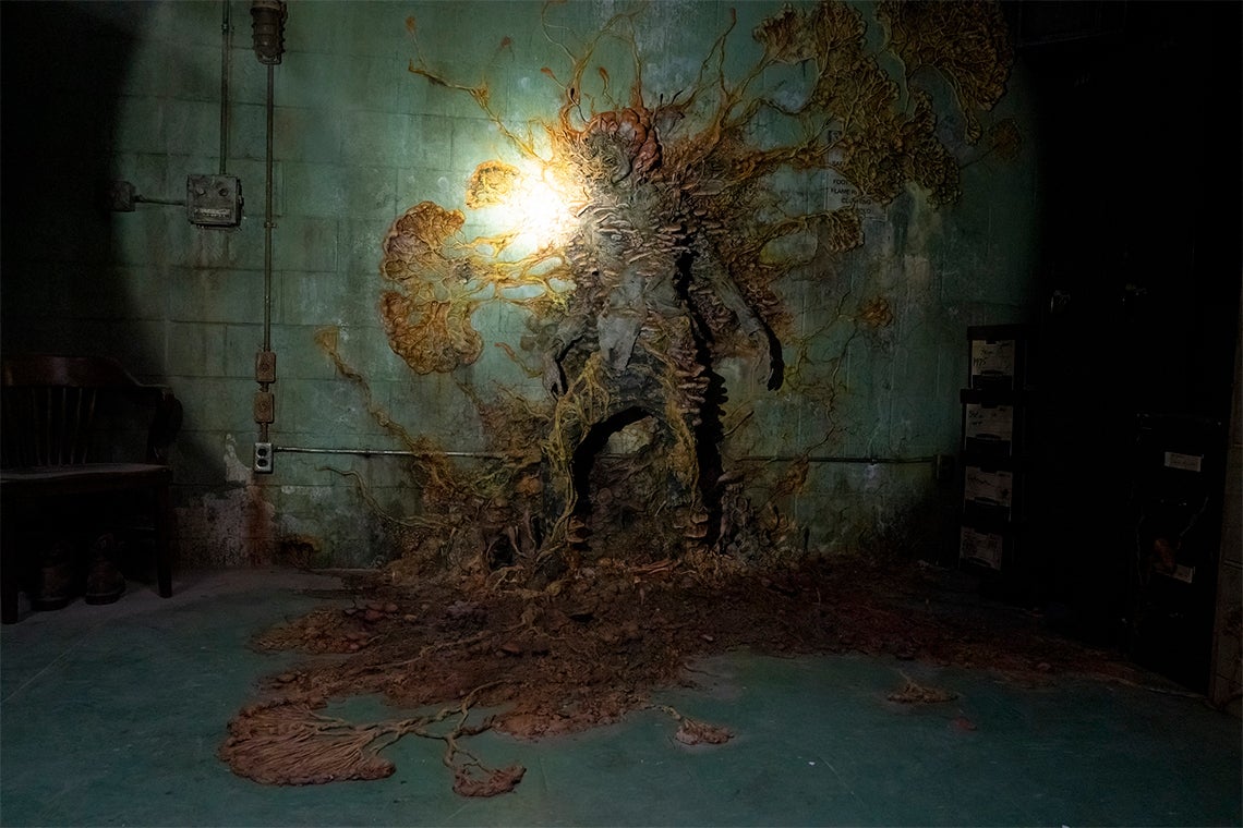 still from The Last of Us showing a human transformed into a fungal zombie