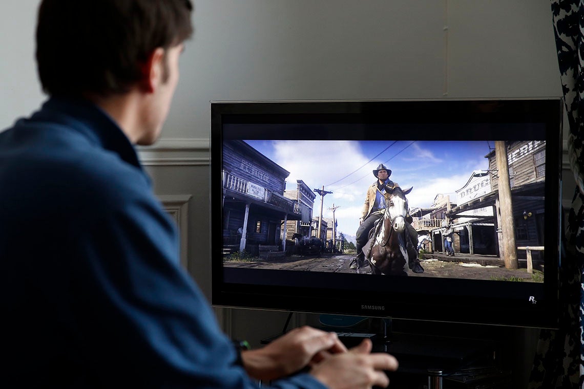 Photo of person playing a video game