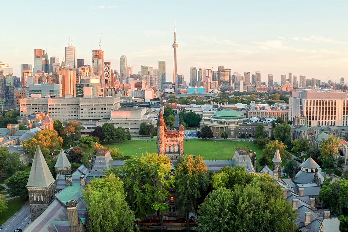aerial photo showing a lush green university of toronto campus at dusk